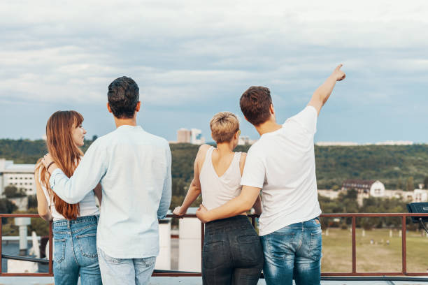 istock Group of friends enjoying outdoors at roof 1160252988