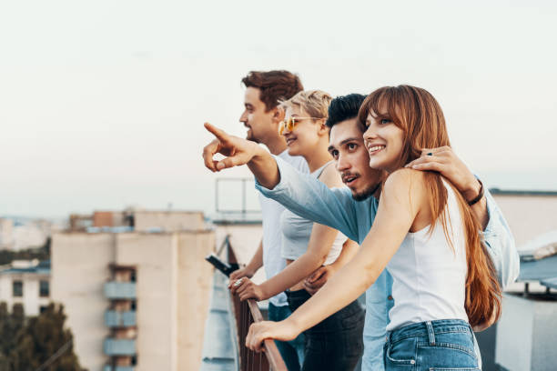 istock Group of friends enjoying outdoors at roof 1160253027