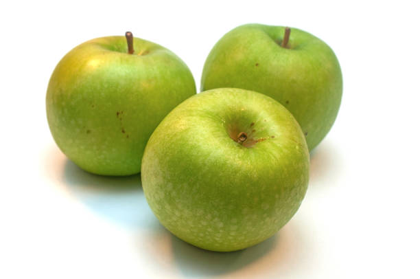 Fresh ripe green apples grenni on white background