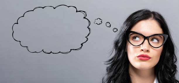 Blank speech bubble with young businesswoman in a thoughtful face
