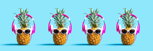 istock Pineapples wearing headphones 1160259544