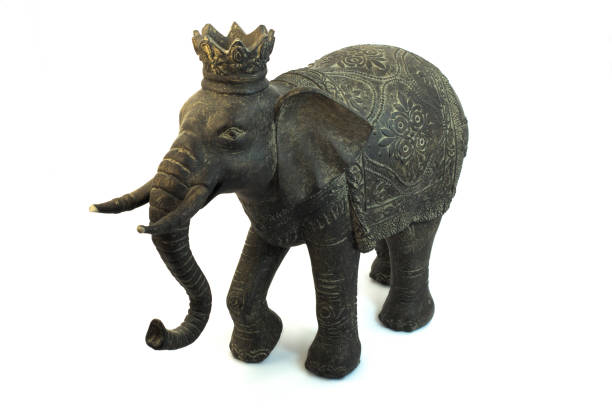 istock Old decorative elephant sculpture isolated on white 1160259838