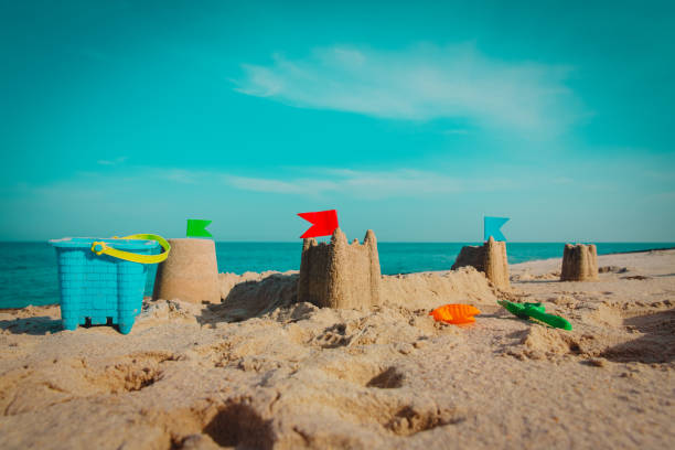 istock Sand castle on beach vacation and toys 1160259862