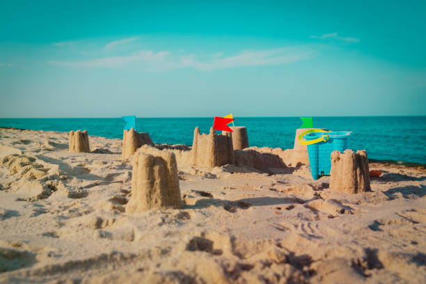 istock Sand castle on beach vacation and toys 1160260962