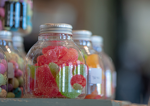 Candy and sweets in glass jars.