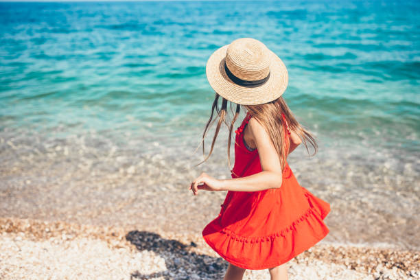 istock Cute little girl at beach during summer vacation 1160270319