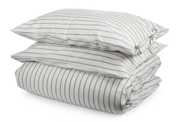 istock linen with pillows and blanket isolated 1160270991