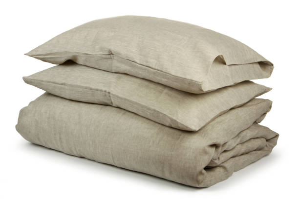 istock linen with pillows and blanket isolated 1160271005