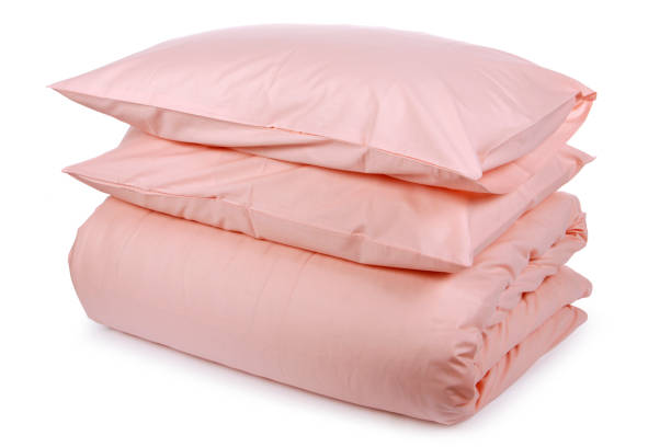 istock linen with pillows and blanket isolated 1160271011