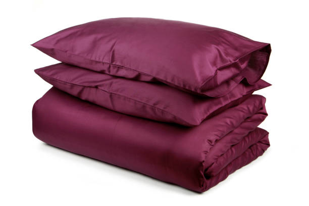 istock linen with pillows and blanket isolated 1160271054