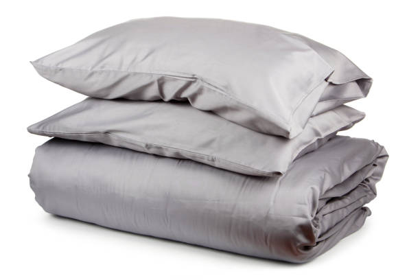 istock linen with pillows and blanket isolated 1160271070