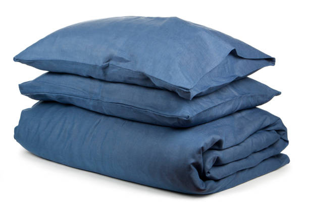istock linen with pillows and blanket isolated 1160271081