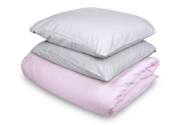istock linen with pillows and blanket isolated 1160271092