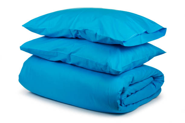istock linen with pillows and blanket isolated 1160271104