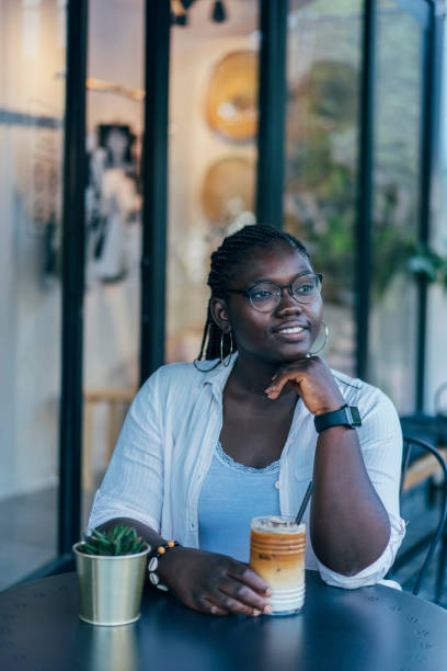 istock African Woman Drinking Coffee at a Cafe 1160271521