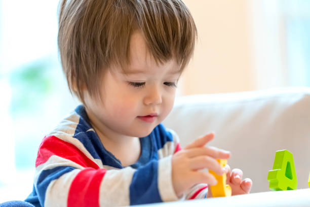 istock Happy toddler boy playing and learning 1160272724