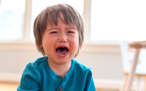 Crying toddler boy stock photo