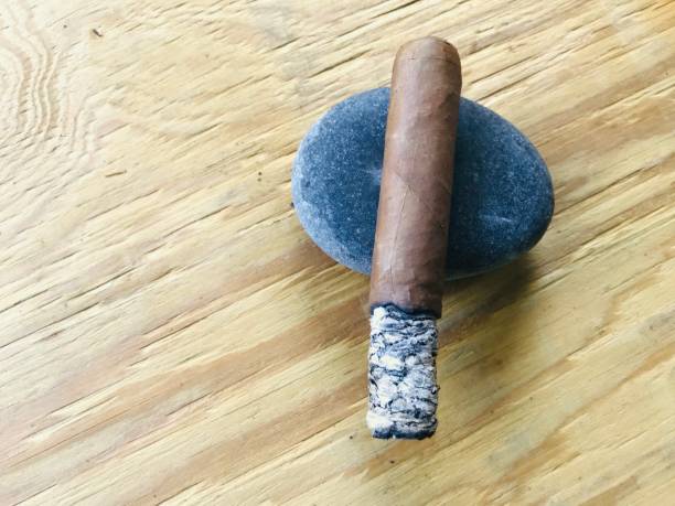 istock close up handmade cigar with long ashes 1160275911