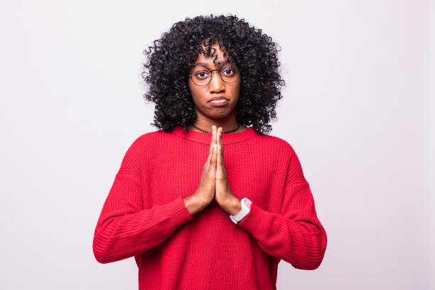 istock Praying african curly woman isolated on white background 1160278202