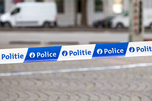 Belgian police tape Brussels, Belgium - July 02 2019: Close-up on a bilingual (french and dutch) police tape. belgium stock pictures, royalty-free photos & images