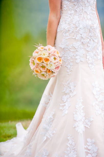 Unrecognizable Bride Holding a Flower Bouquet Outdoors.