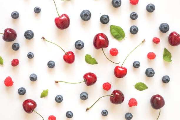 istock Summer Berries against White Background food composition. Top view. 1160288980