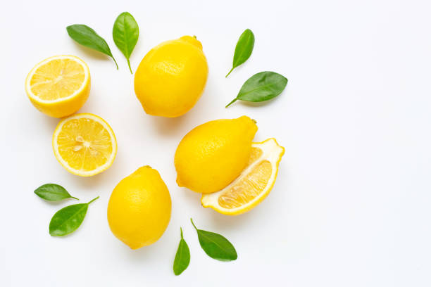 istock Fresh lemon with leaves isolated on white 1160293979
