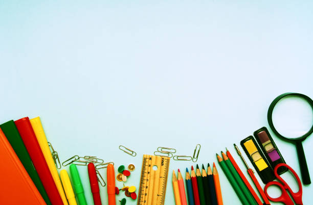 istock Colorful  school suplies against light blue background with copy space. Back to school concept, top view. 1160294087