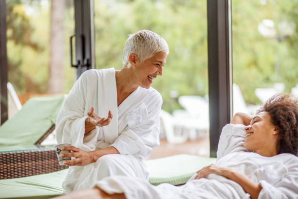 istock Two friends at a spa having a relaxing conversartion 1160297018