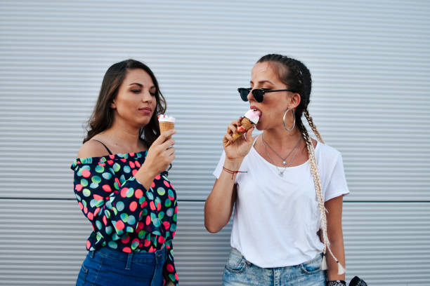 istock Beautiful women eating ice cream 1160297207