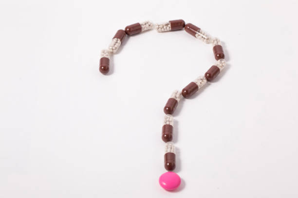 istock Question mark made of pills. 1160297611