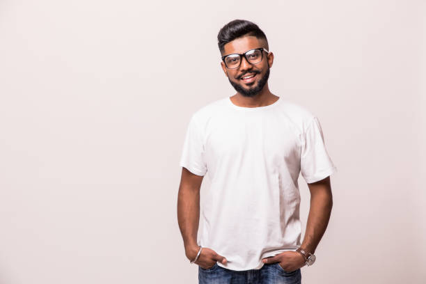 istock Young indian handsome man in eyesglasses standing isolated on white background 1160298390