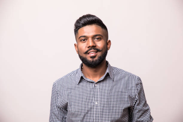 istock Young indian man standing isolated on white background 1160298909