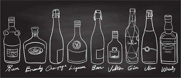 Variety of alcohol bottles, freehand drawn illustration on chalkboard