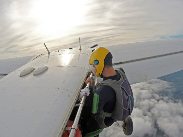 istock Parachutist hanging on the airplane door 1160305075