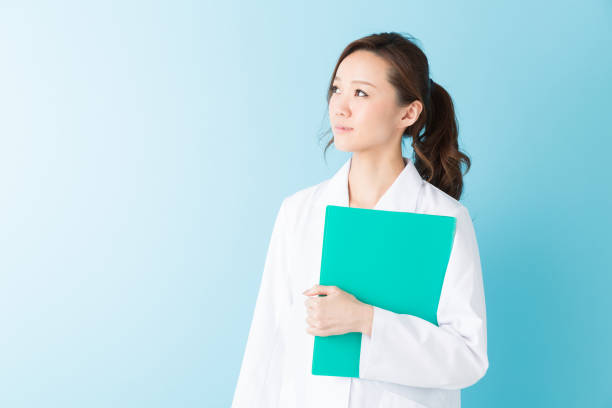 istock woman in a white coat 1160305781