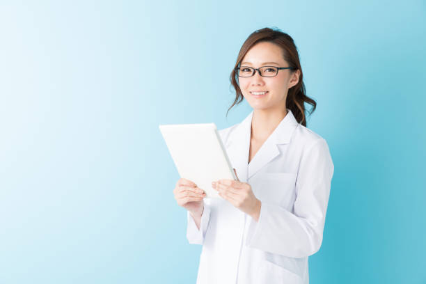 istock woman in a white coat, 1160305811