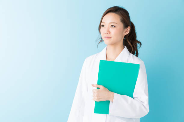 istock woman in a white coat 1160305814