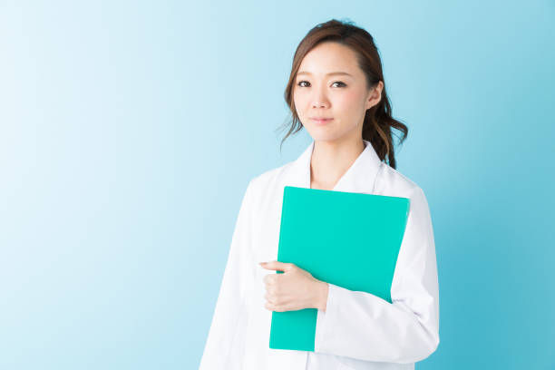 istock woman in a white coat 1160305815