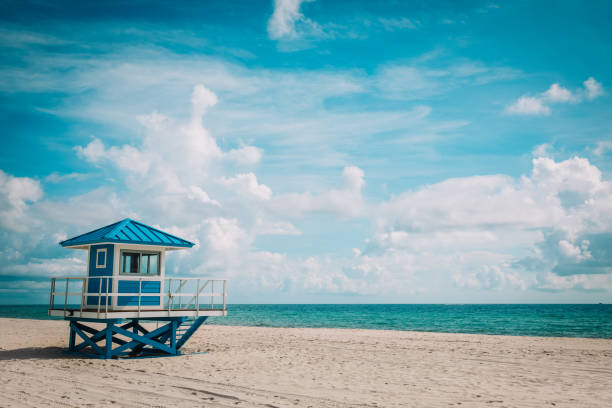 istock tropical beach with lifeguard cabin, Florida, USA 1160313890