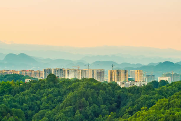Cranes and construction equipment with mountain background