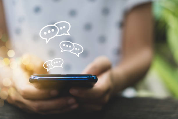 istock Woman hand using smartphone with chat icon background. Business communication social network concept. 1160316443