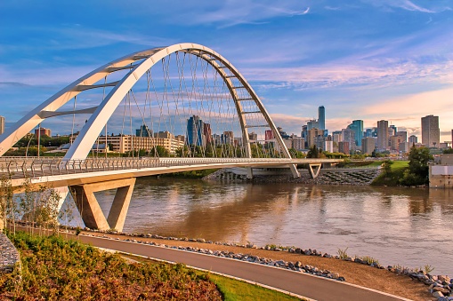 A scenic view of the iconic Walterdale Bridge and its walkway in Edmonton