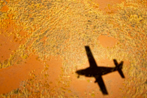 Flying over Damarland Shadow of small plane, aerial view Damaraland, Kaokoland wilderness in NW region of Namibia, Africa kaokoveld stock pictures, royalty-free photos & images