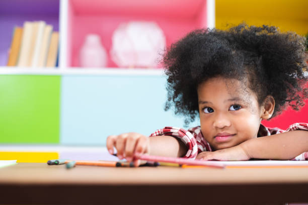 istock African cute kids studying  at home, kids education concept 1160323196