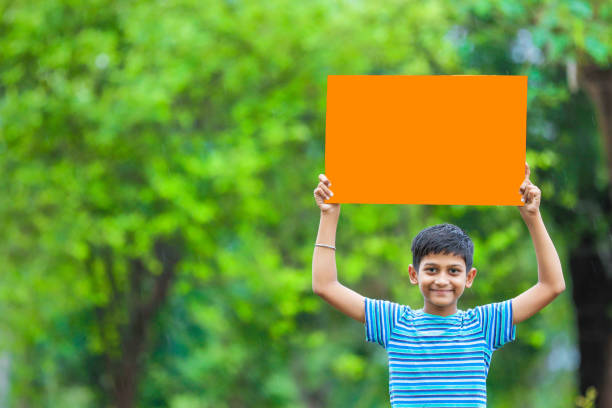 indian child holding poster