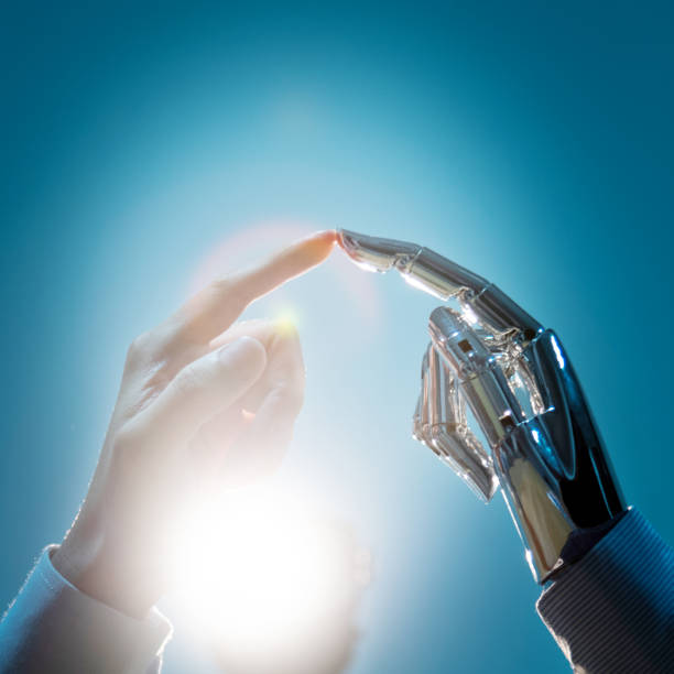 istock Businessman finger touching robot finger 1160331758