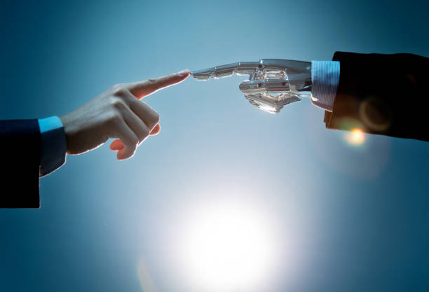 istock Businessman finger touching robot finger 1160331764