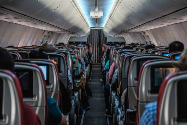 istock Modern Airplane seats aisle. Transportation concept. Aircraft's corridor interior 1160331896