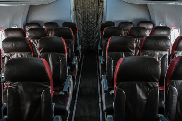 istock Modern Airplane seats aisle. Transportation concept. Aircraft's corridor interior 1160332470